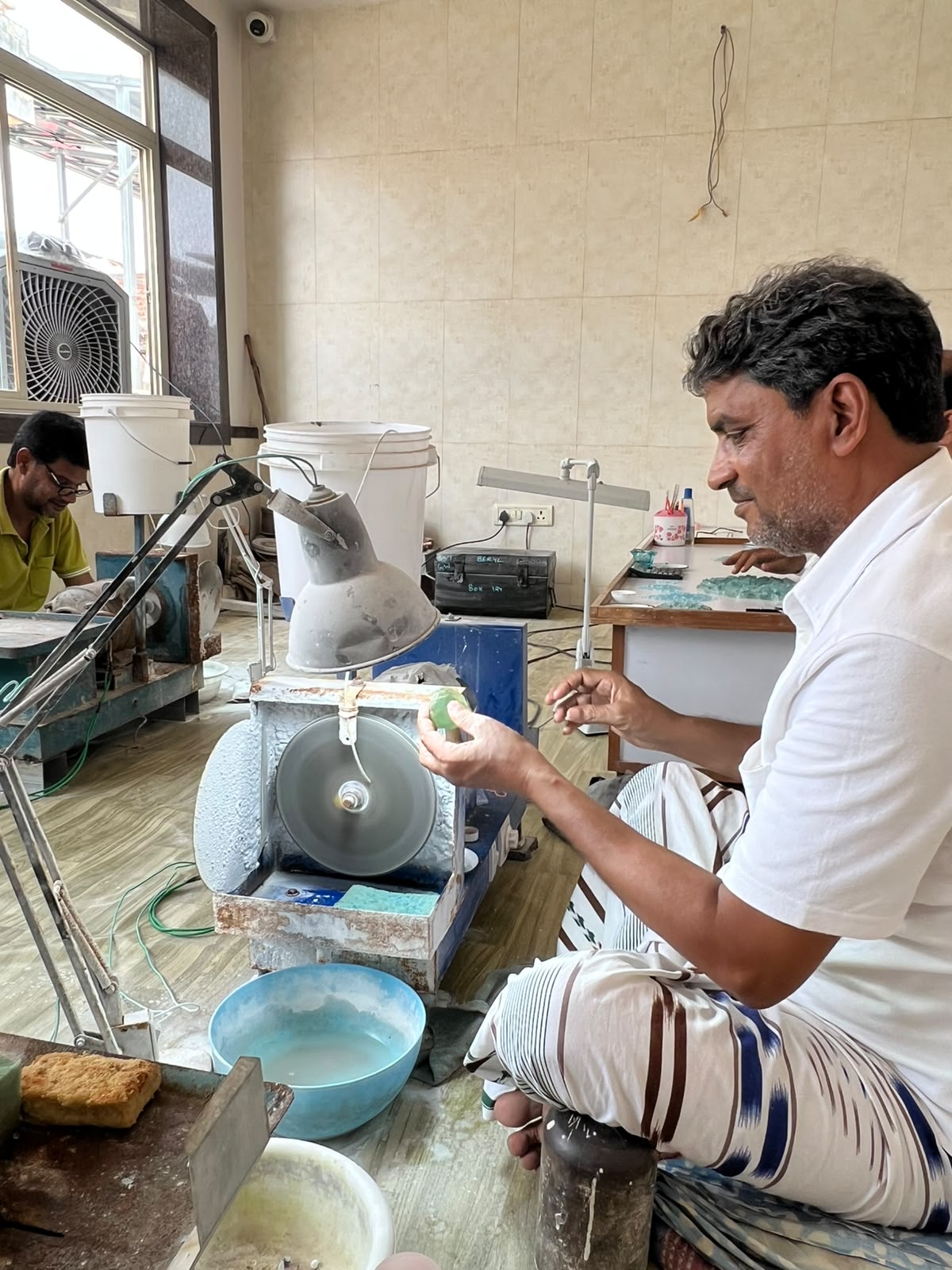 Cutter shaping a stone at the workbench